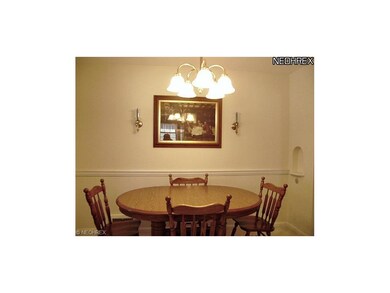 Neutral colors on the first floor and a warm, chair-railed dining room.