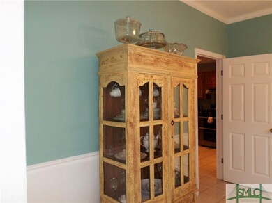 Dining room has entrance to kitchen, which can be 
