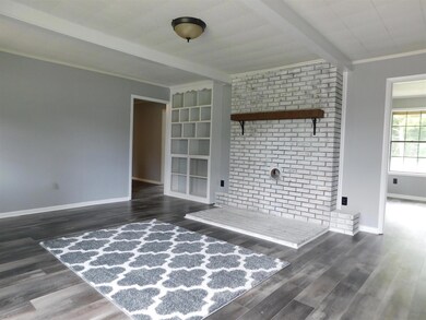 Only one of the 2 family rooms, this family room boasts a fireplace ready for a wood burning stove and built-ins ready for family pictures. 