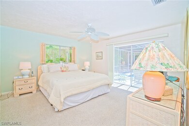 Primary Bedroom with sliders that exit to lanai