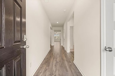 Corridor featuring hardwood / wood-style flooring