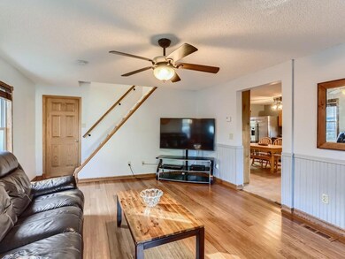Living room looking towards the stairs leading up.