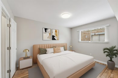 One of the two bedrooms. [virtually staged]