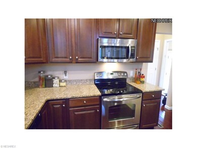 Beautiful cherry cabinets and granite countertops.