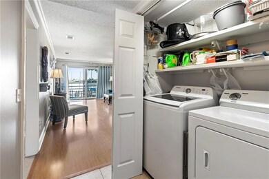 Laundry area is behind bifold doors in entry hallway with convenient access to both bedrooms