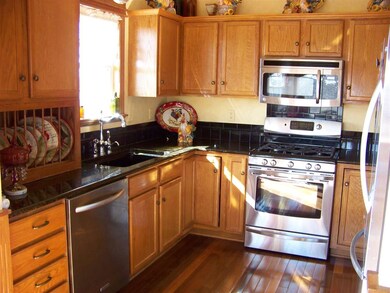 Granite counter tops & Brazilian wood flooring wit