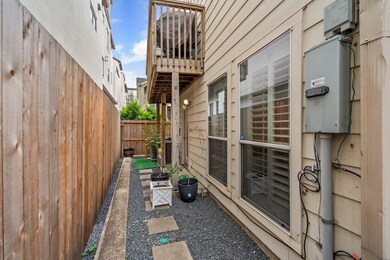 Side yard with second floor balcony, perfect place to add a grill. No HOA!