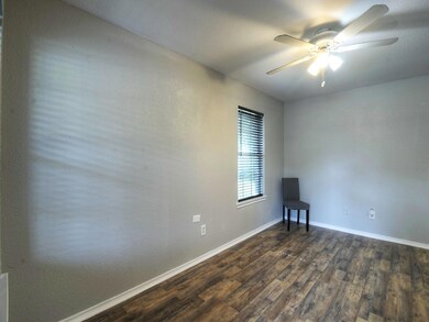Living Room with ceiling fan and dark hardwood / w