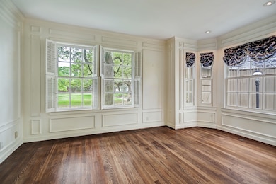 Study with courtyard views and bay window. This room has access to a full bath if needed as a 4th bedroom or guest room.