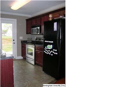 Cherry cabinets with stainless appliances