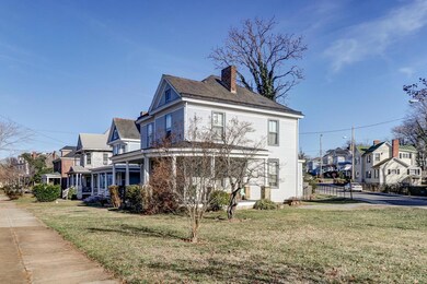 SIDE OF HOME.  NICE PINK DOGWOOD GETTING READY TO BLOOM.