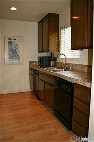 INVITING KITCHEN WITH GRANITE TILE & LOTS OF COUNT