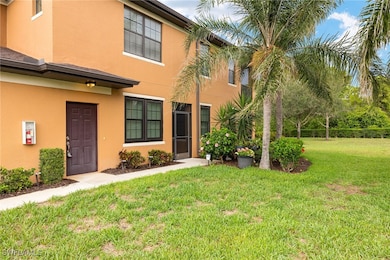 Townhome / multi-family property featuring a front