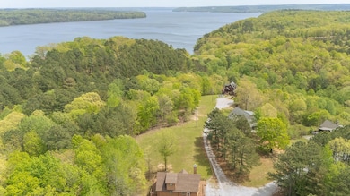 Aerial view featuring a water view and a view of t