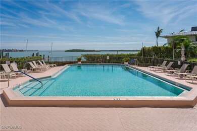 View of swimming pool featuring a patio and a wate