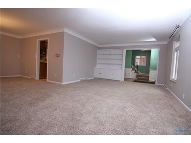 Living Room also features nice bookcase with shelv