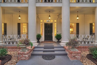 Brick steps with decorative iron railings fully wrap the first and second floor verandas. Warmth and southern comfort welcome your guests and family to this beautiful home.