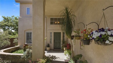 Welcoming Entry w/ Seat Wall and Fountain