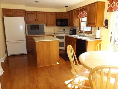 Large eat in kitchen with island and gleaming hard