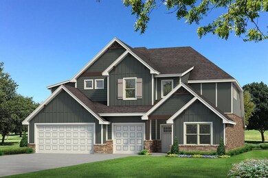 Craftsman-style home with a garage and a front law