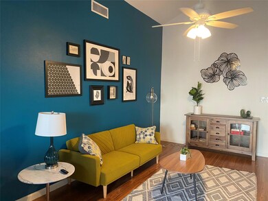 Living area with ceiling fan, high vaulted ceilin