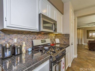 Elegant Kitchen with Granite Counter Tops and Stai