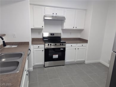 Kitchen featuring stainless steel range with elect