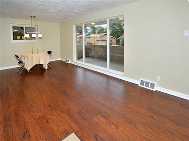 The Combination Living Room / Dining Room and Open