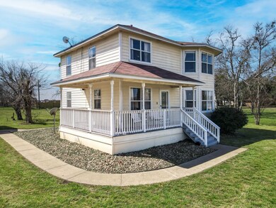 View of front of property featuring covered porch,