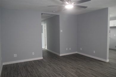 View from the front door. Hallway to the left, kit