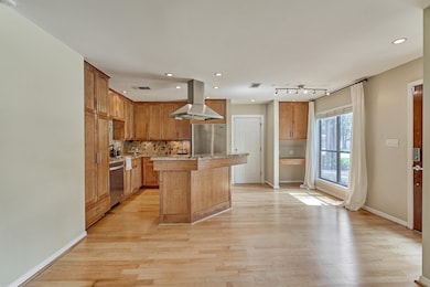 View from den into the open kitchen with great nat