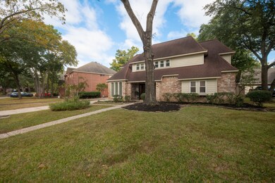 Here is another angle on this wonderful 2 story home in this community with established mature trees.