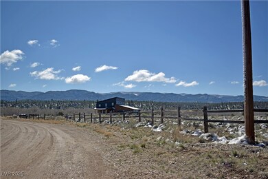 View of mountain backdrop featuring rural landscap