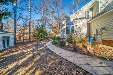 Fenced in back yard with shed on corner lot.