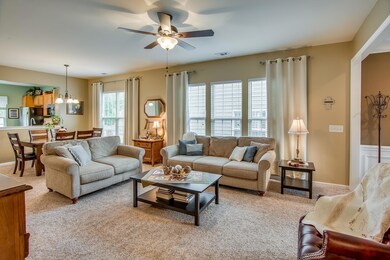 The living room is large and can accommodate many styles of furniture.