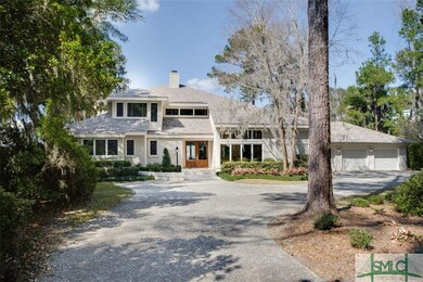 A meandering driveway.  The home fits snuggly into