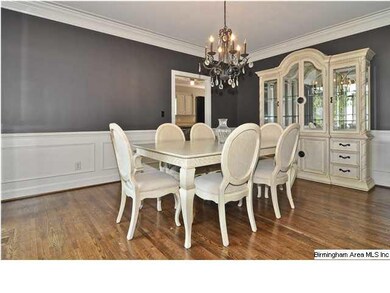 Banquet-sized dining room with hardwood flooring.