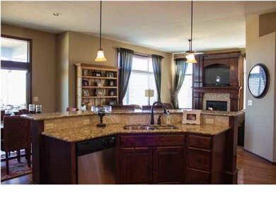 KITCHEN EATING BAR WITH VIEW OF FIREPLACE