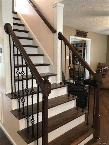 beautiful wood staircase leading to the second flo