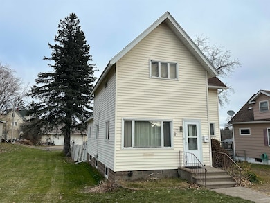 Traditional-style house featuring a front yard