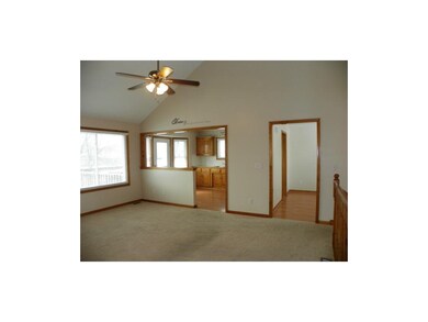 Living room opens to kitchen and dining area.