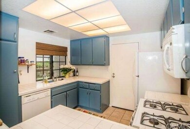 Large window over the sink adds lots of light and 