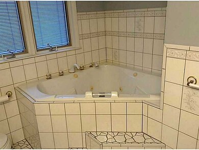 Bathroom. First floor bath has tile jetted tub and bidet.