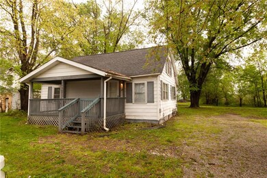 Angled with view of double lot, double wide gravel parking area