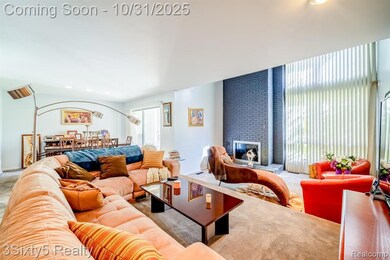 Living room with recessed lighting and a brick fireplace