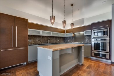 Kitchen with built in appliances, backsplash, a si