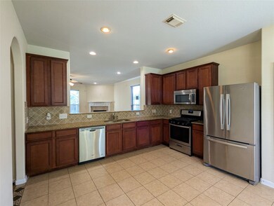 Spacious kitchen with lots of cabinet space, tile floor easy to maintain
