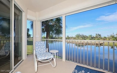 Sunroom with a water view