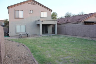 Large backyard with covered patio