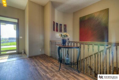 Fall in love with the large entryway and the curved wall on the staircase.